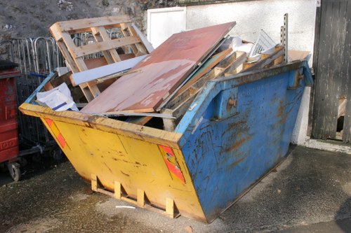 Investigator reviewing records during a waste removal complaint process