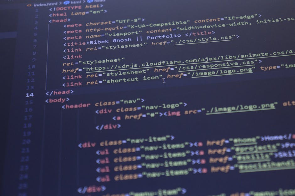 A close-up image of a computer screen displaying lines of colorful programming code, with keywords and syntax highlighted in red, blue, green, yellow, and white against a dark background. The code app